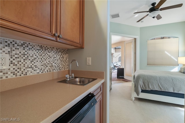 bedroom with ceiling fan and sink