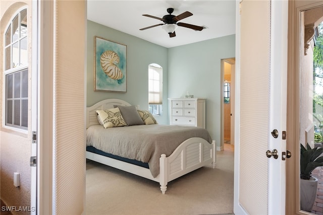 carpeted bedroom featuring ceiling fan