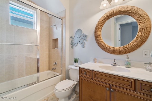 full bathroom with tile patterned flooring, vanity, shower / bath combination with glass door, and toilet