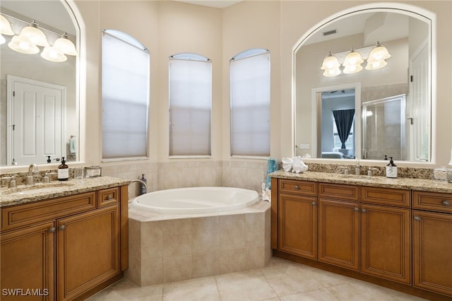 bathroom with vanity, tile patterned flooring, and independent shower and bath