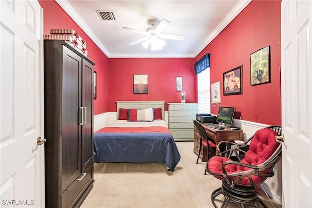 bedroom with ceiling fan, light carpet, and ornamental molding