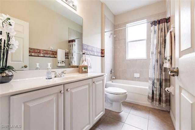 full bathroom with tile patterned floors, shower / bath combo, toilet, and vanity