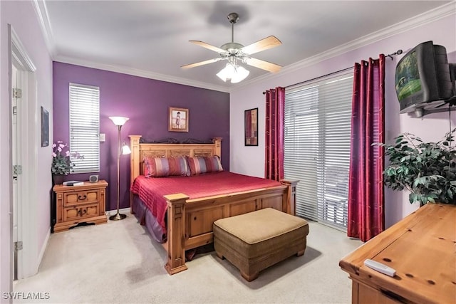 carpeted bedroom with access to exterior, ceiling fan, and ornamental molding