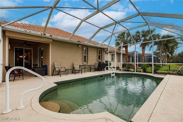 view of pool with a patio area and a lanai