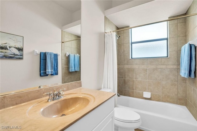 full bathroom featuring vanity, toilet, and shower / bath combo with shower curtain