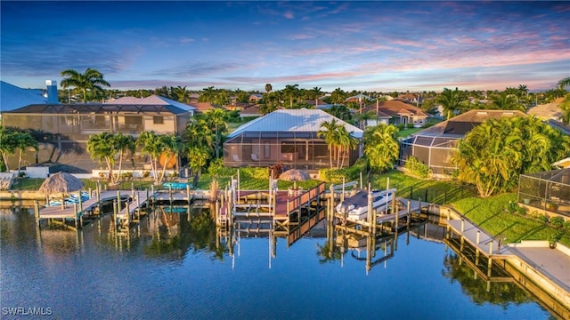 aerial view at dusk with a water view