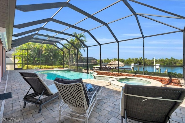 view of patio / terrace featuring a lanai, a pool with hot tub, and a water view