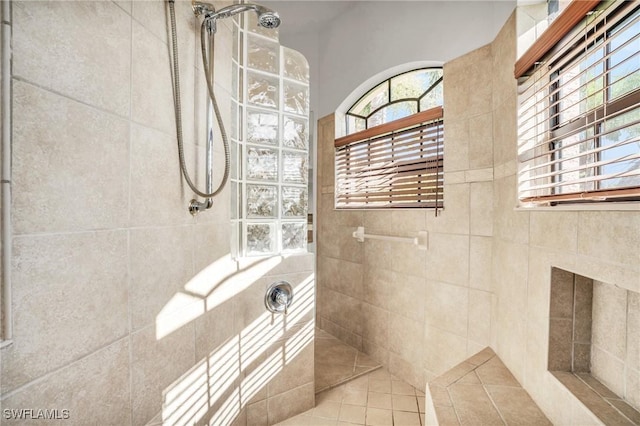 bathroom featuring a tile shower