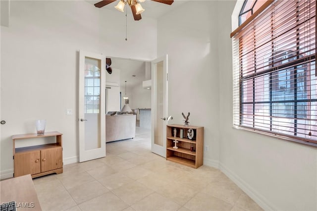 interior space featuring light tile patterned flooring and french doors