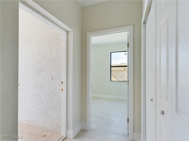 corridor featuring light tile patterned floors