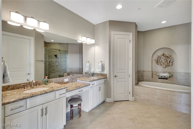 bathroom featuring tile patterned flooring, vanity, and independent shower and bath