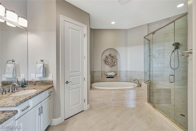 bathroom with vanity, tile patterned floors, and independent shower and bath