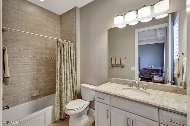 full bathroom with vanity, shower / bath combo, and toilet