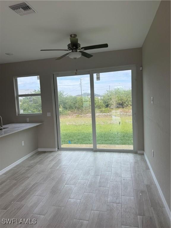 interior space featuring a wealth of natural light and ceiling fan