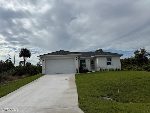 single story home with a garage and a front lawn