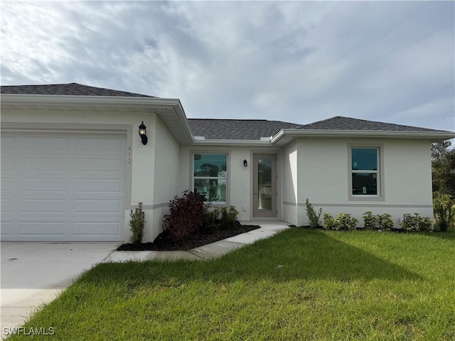 ranch-style house with a front yard and a garage