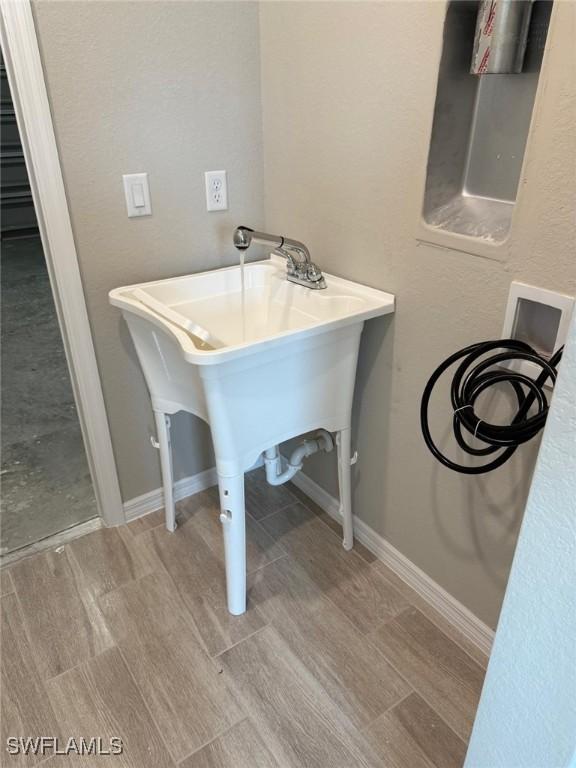 laundry room featuring sink and hookup for a washing machine