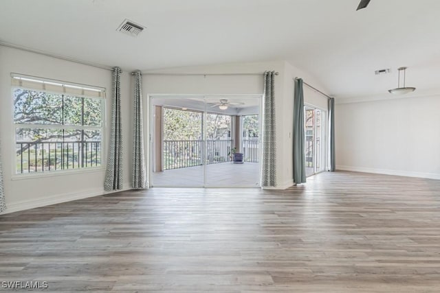 unfurnished living room featuring light wood-type flooring, ceiling fan, and lofted ceiling