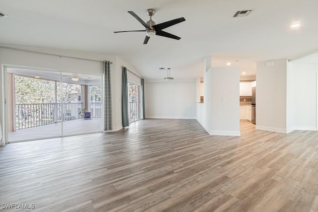 unfurnished living room with light hardwood / wood-style floors and ceiling fan