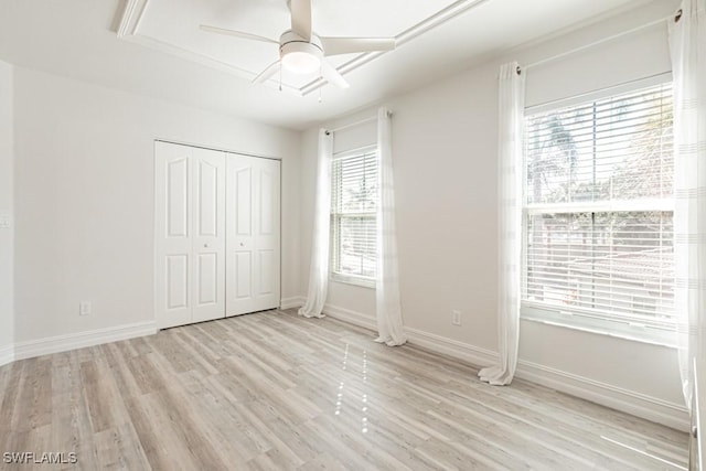 unfurnished bedroom featuring a closet, ceiling fan, and light hardwood / wood-style floors