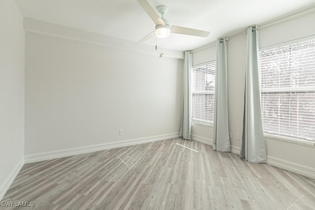 spare room with ceiling fan and light hardwood / wood-style floors