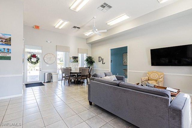 living room featuring ceiling fan and light tile patterned flooring