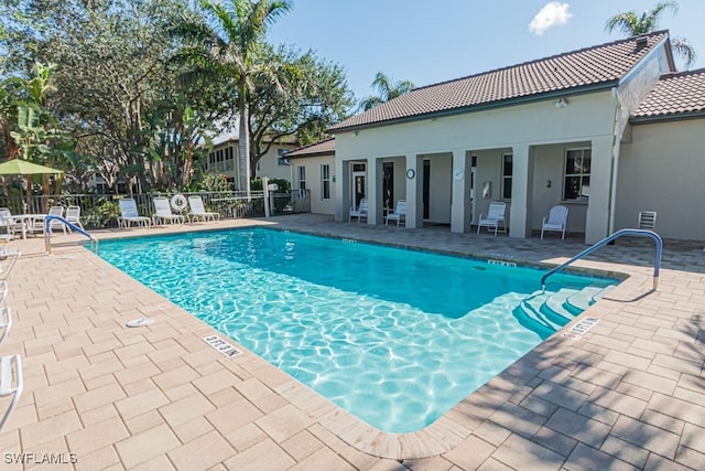 view of pool featuring a patio