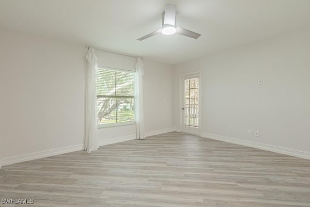 unfurnished room with light hardwood / wood-style flooring and ceiling fan