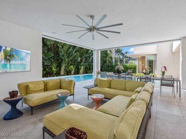 view of patio featuring a ceiling fan, an outdoor pool, and an outdoor hangout area