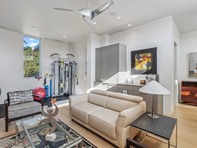 living area with light wood-style floors and recessed lighting