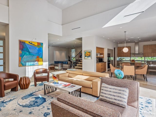 interior space with stairs, a high ceiling, and recessed lighting