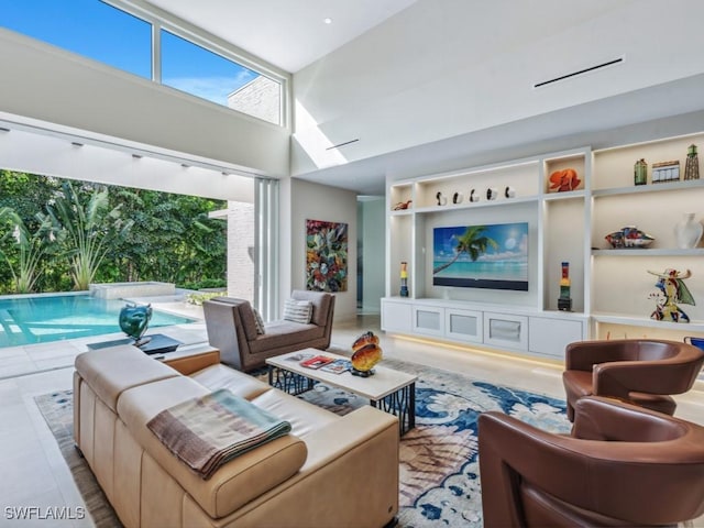 living area with a high ceiling