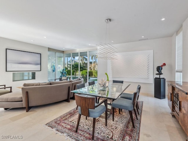 dining space with an inviting chandelier, floor to ceiling windows, and recessed lighting