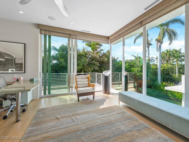 sunroom / solarium featuring visible vents and a wealth of natural light