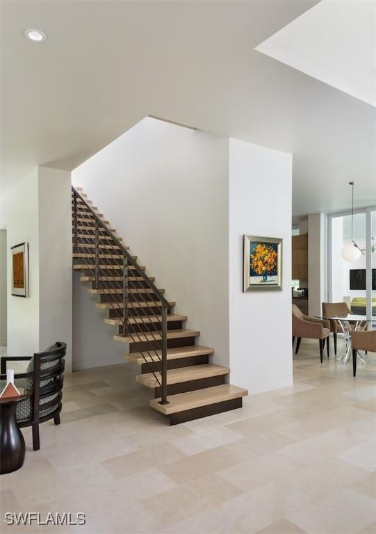 staircase with recessed lighting