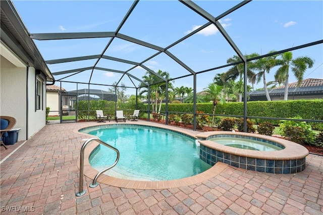 3926 Sapphire Way, Naples, FL 34114 - view of swimming pool with glass enclosure, a patio area, and a pool with connected hot tub