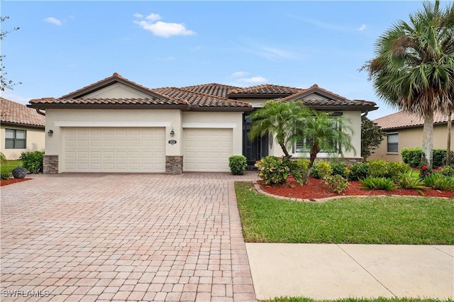 mediterranean / spanish-style home with a garage