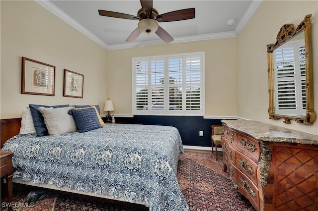 bedroom with ceiling fan and crown molding