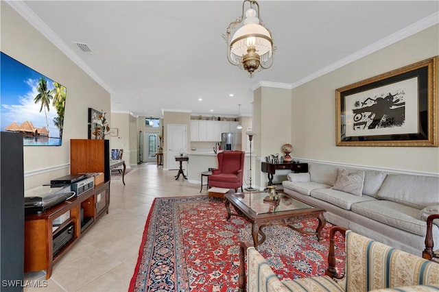 tiled living room featuring crown molding and a chandelier