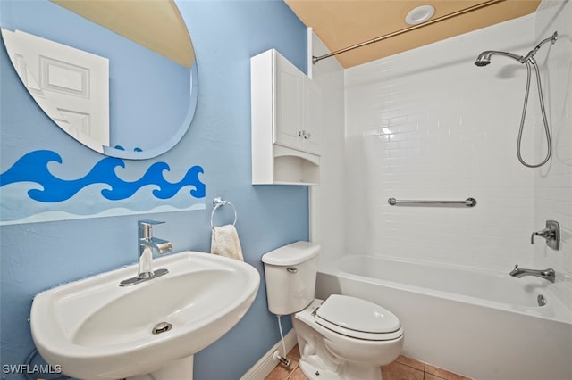 full bathroom with toilet, tile patterned floors, tub / shower combination, and sink