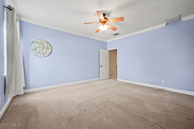 spare room with carpet, ceiling fan, and ornamental molding