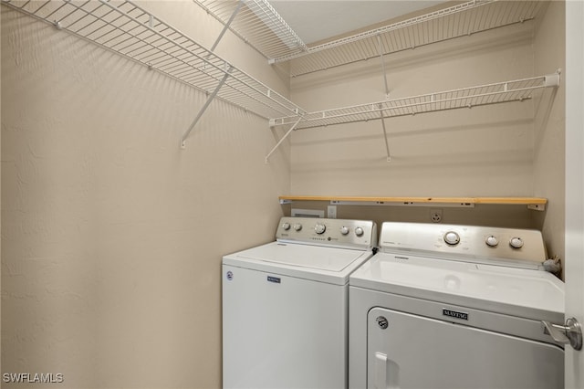 laundry area featuring separate washer and dryer