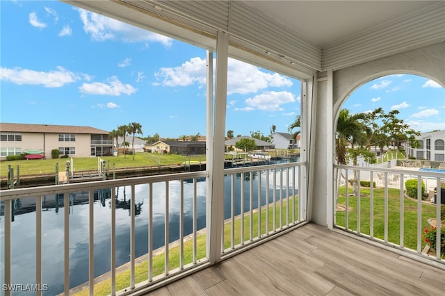 balcony featuring a water view