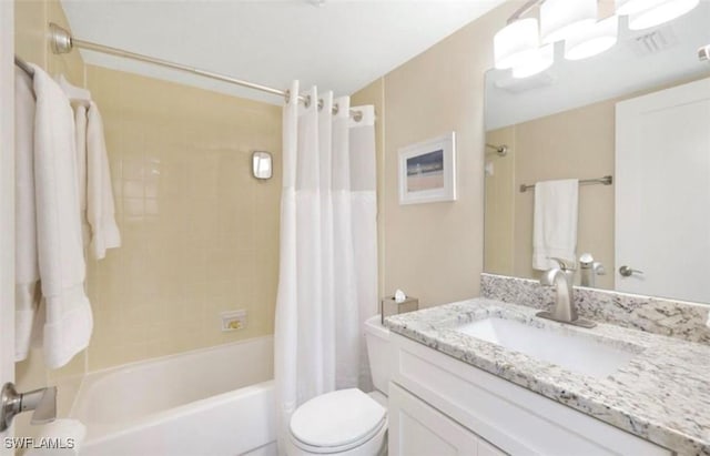 full bathroom with vanity, shower / bath combination with curtain, and toilet