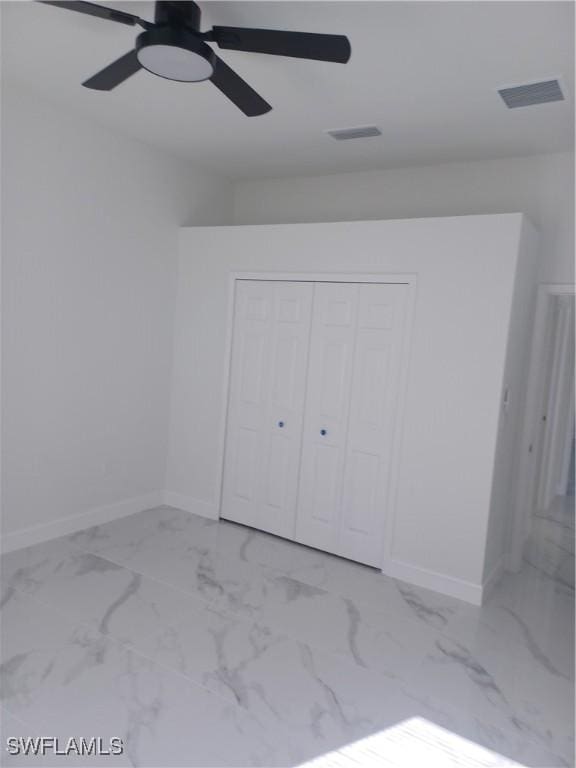 unfurnished bedroom with a closet and ceiling fan