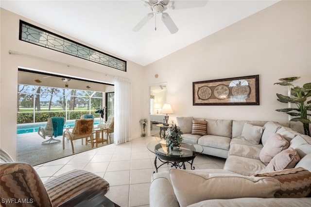 living room with high vaulted ceiling, light tile patterned floors, and ceiling fan