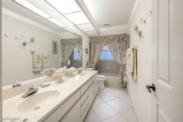 full bathroom featuring shower / tub combo with curtain, vanity, tile patterned floors, and toilet