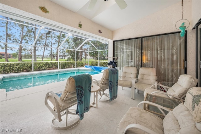 view of swimming pool with a lanai and a patio area