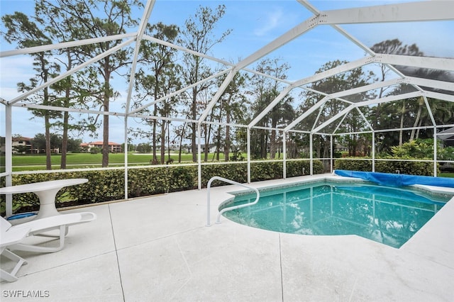 view of pool featuring a lanai and a patio