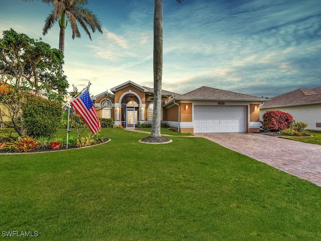 single story home with a front lawn and a garage